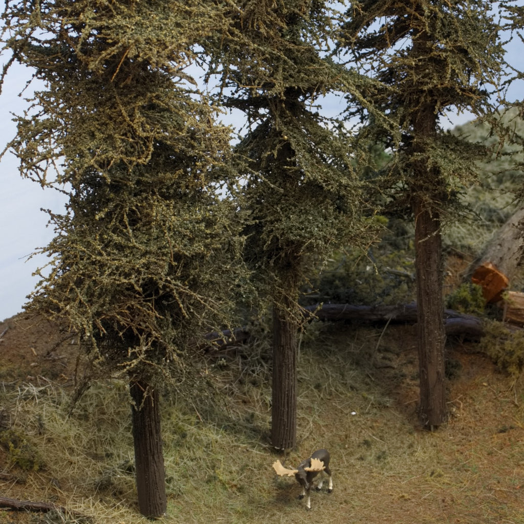 Three 11 inch Standard Fir Trees on a diorama with a HO scale Preiser moose by Roger Rasmussen Coastman's Scenic Products