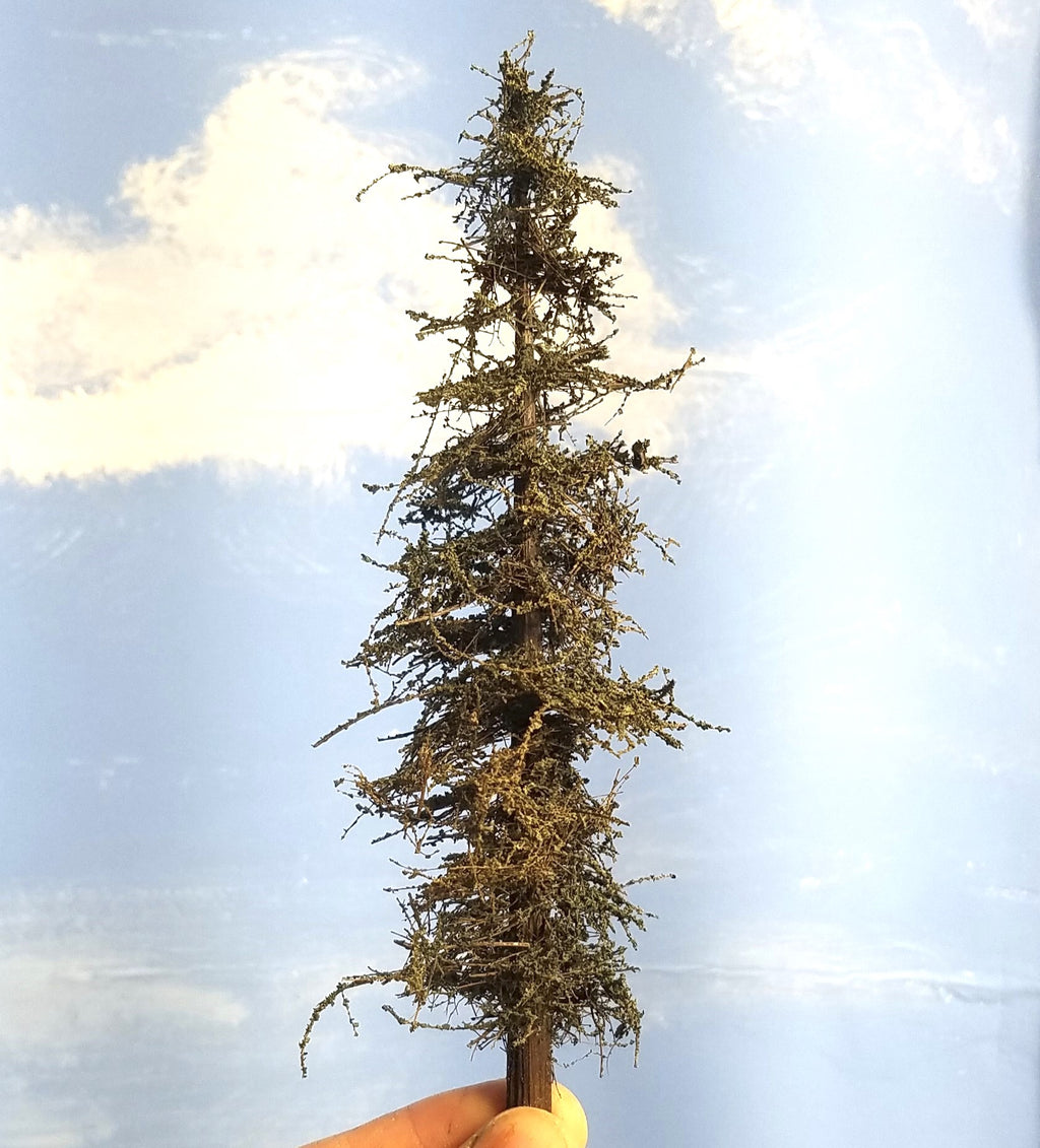 One handheld 7-inch tall Standard Fir Tree made by Roger Rasmussen, Coastman's Scenic Products