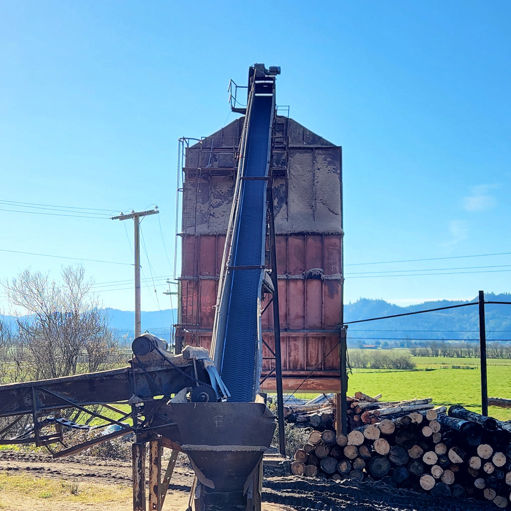 Prototype 1:1 scale wood chip storage bin with conveyor belt apparatus used for model making at Coastman's Scenic Products model factory. Photo by Roger Rasmussen, CSP LLC.