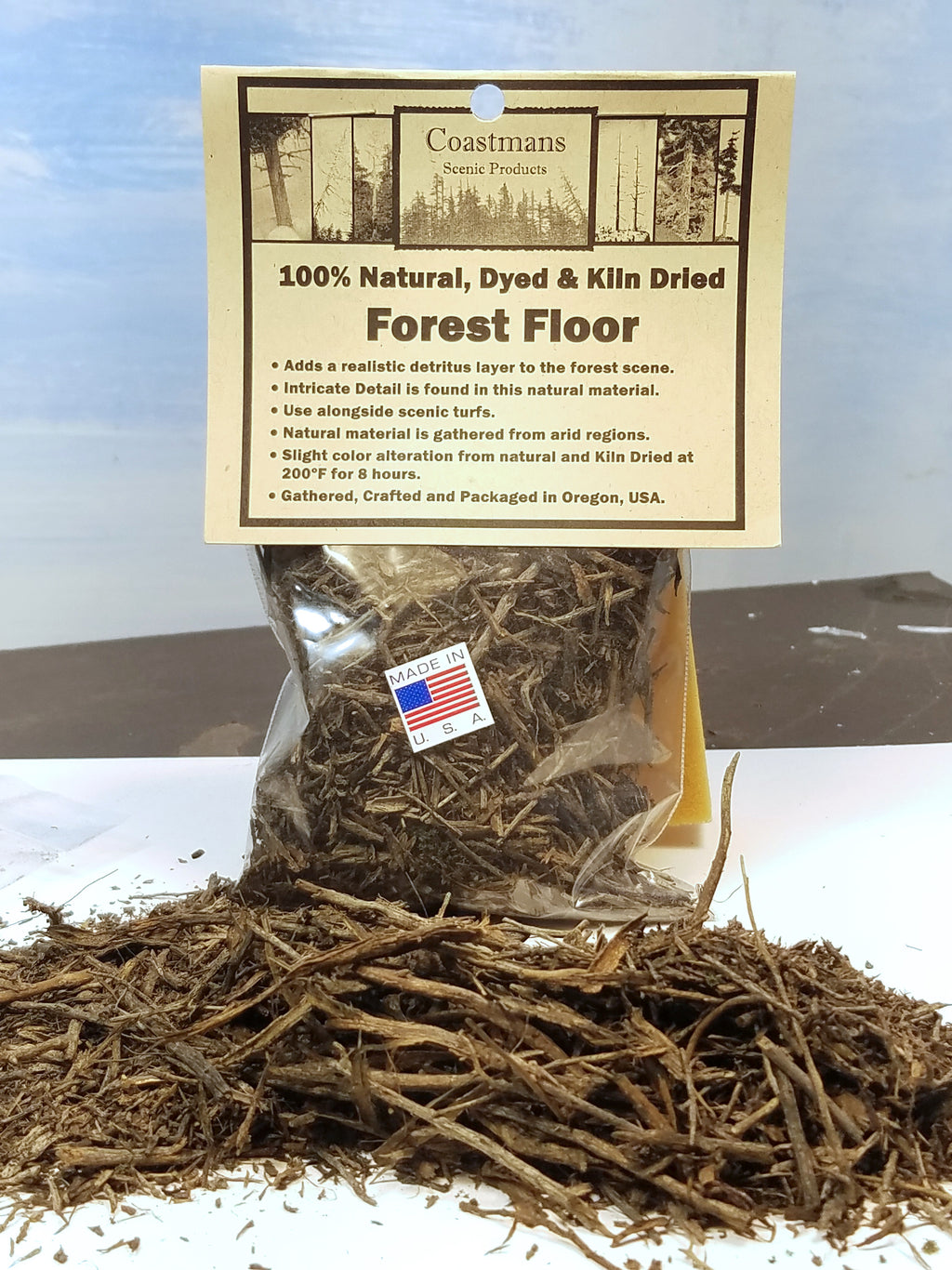 Open package of Coastman's 100% Natural Dyed & Klin Dried Forest Floor product with packaging on a white background