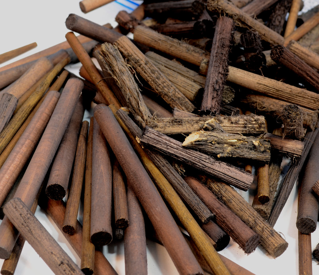 Open bag of Coastman's Pilings showing detail on dyed and dried port orford cedar and bamboo cut off materials useful for modeling pilings in HO, O, and S scales.