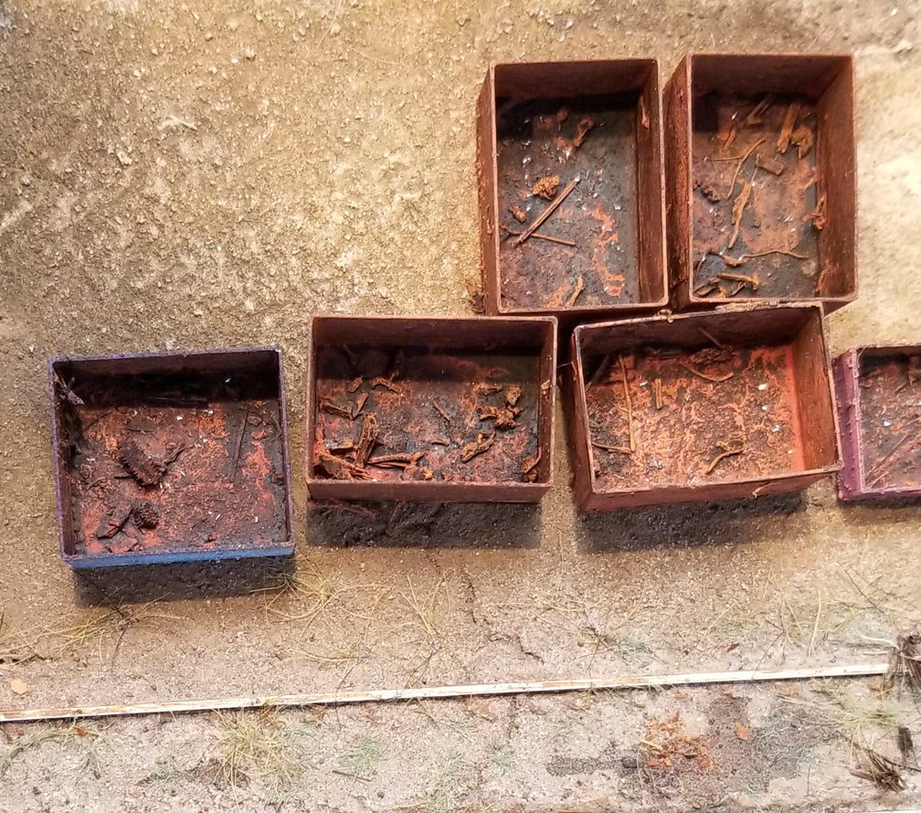 Rusty metal bits contained in scrap metal bins handmade in HO scale by Coastmans Scenic Products, Oregon USA