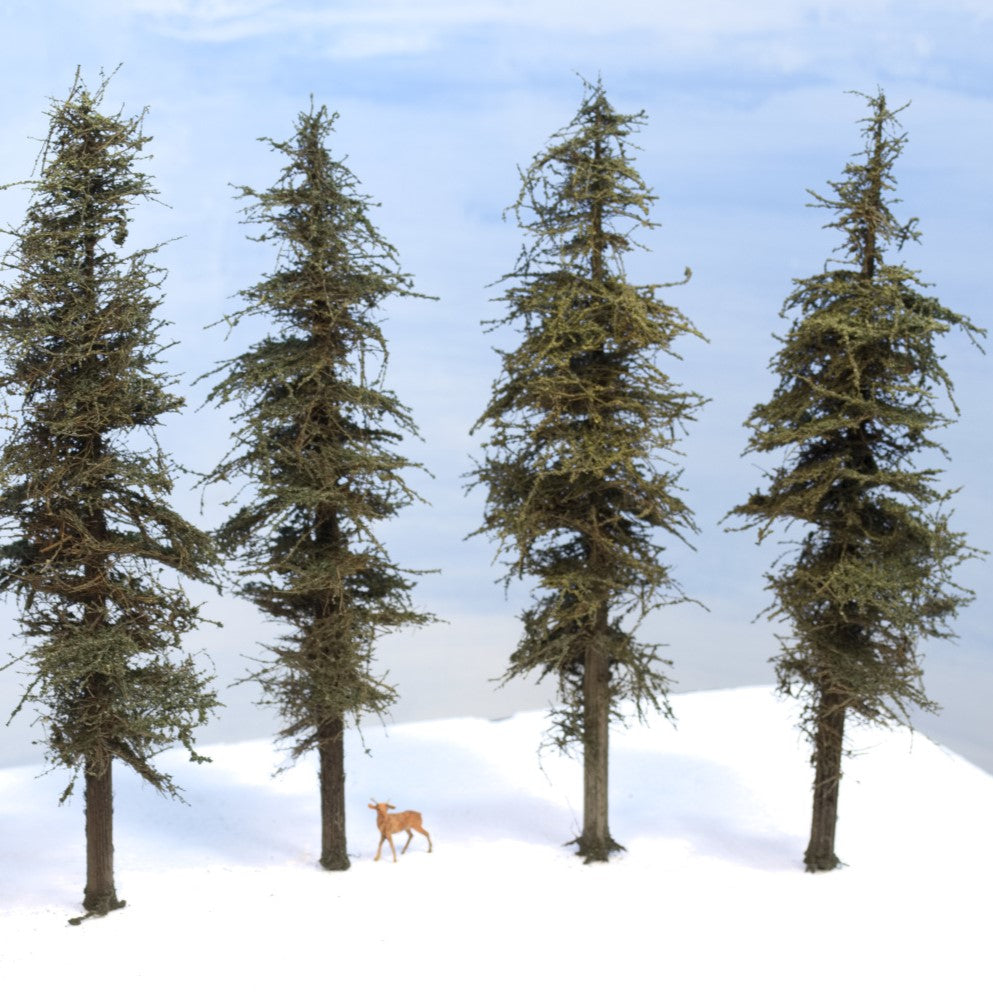 Model fir trees 9 inches tall on a foam white base with HO scale deer for scale using exclusive green branches foliage on port orford cedar tapered trunks