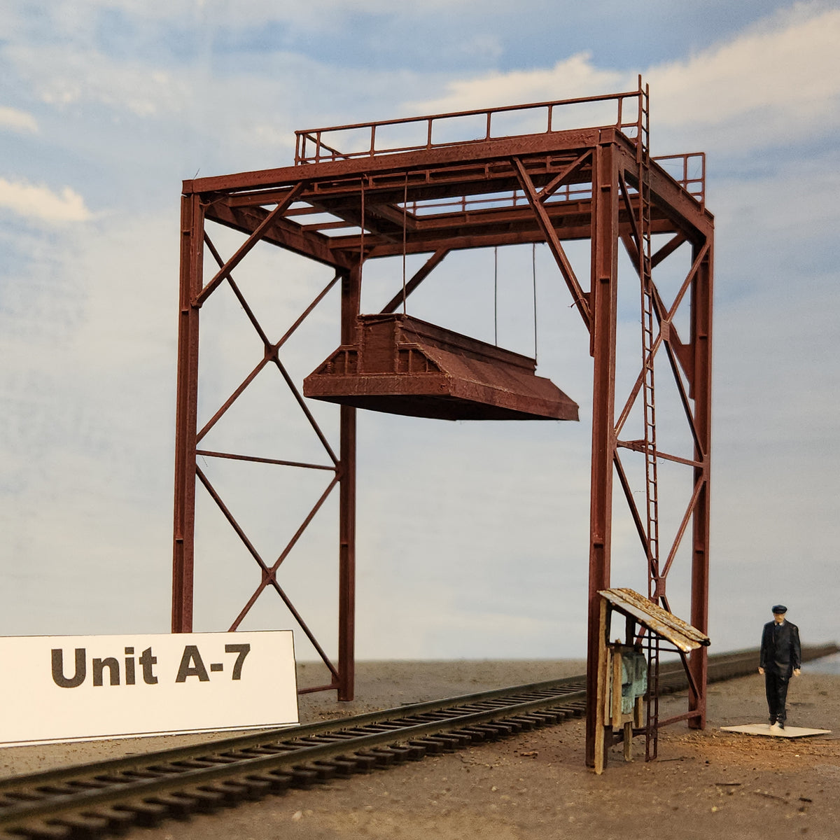 HO scale wood chip loader model unit A-7 end view with HO track and figure for size reference by Coastman's.