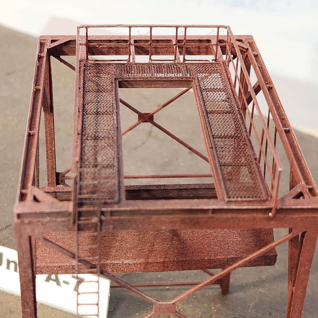 Overhead angled close up shot of the Unit A-7 Wood Chip Loader offered by Coastman's showing safety rail, ladder and grated walkway details.