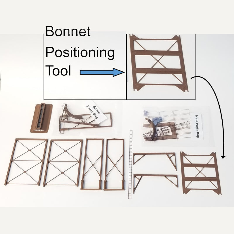 Early photograph of the contents included in the HO scale Wood Chip Loader Kit produced by Coastman's Scenic Products. The kit now includes additional parts for elevating the structure as desired.