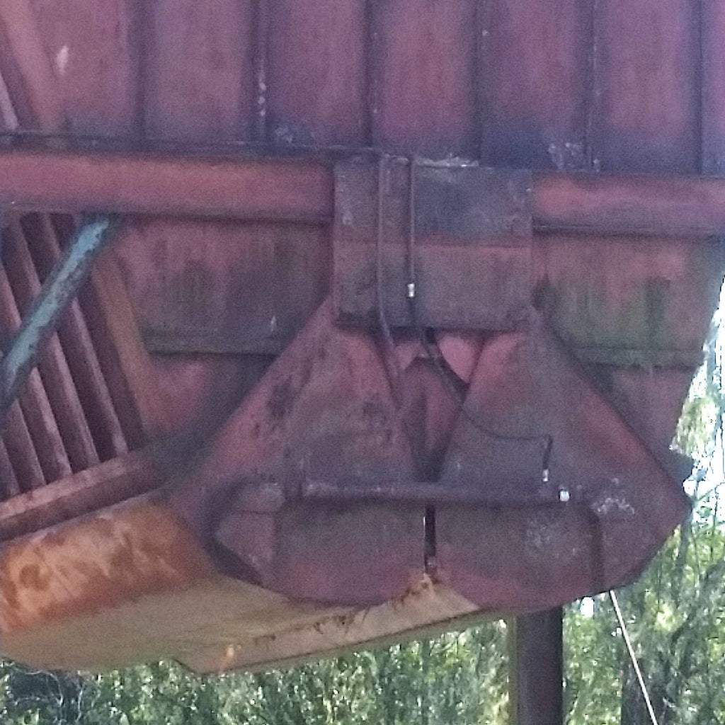 Prototype 1:1 rusty chip bin hinged hydraulic opening doors, located in Oregon, USA used as reference for 1:87 model construction. model building by Roger Rasmussen, Coastman's Scenic Products, CSP LLC Port Orford, Oregon USA