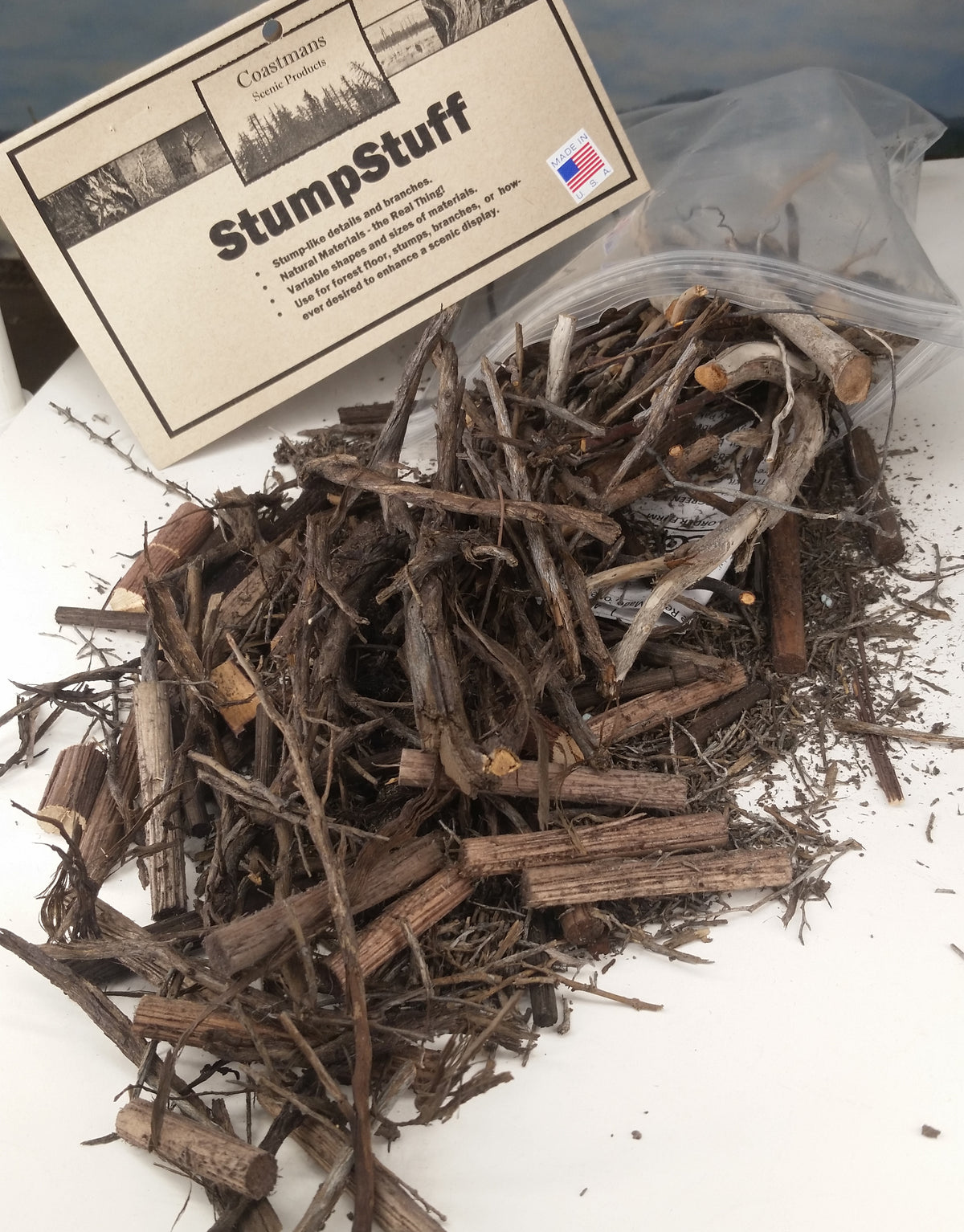 Package of StumpStuff open and spread out, showing detail of scenic material inside